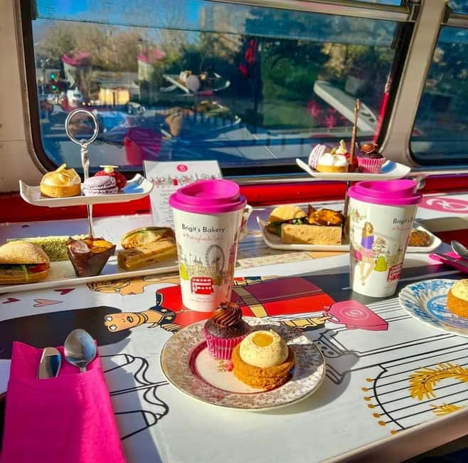 London: Afternoon Tea Sightseeing Bus Tour - The high tea setup: tea, sandwiches, and the sweet stuff