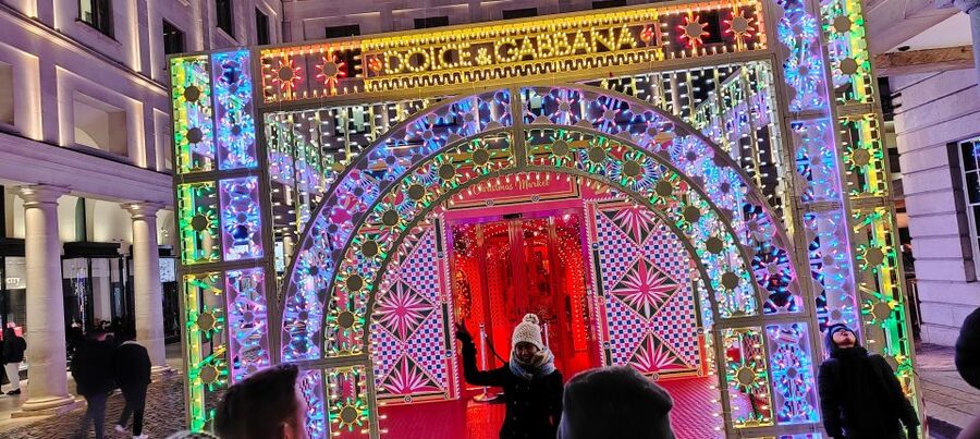 London Christmas Sparkle Walking Tour Small Group - Regent Street angels and carols: festive atmosphere on the move