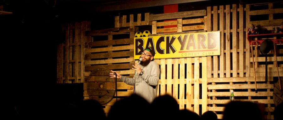 London: Friday Night at The Backyard Comedy Club - Pizza, snacks, and drinks without missing the action